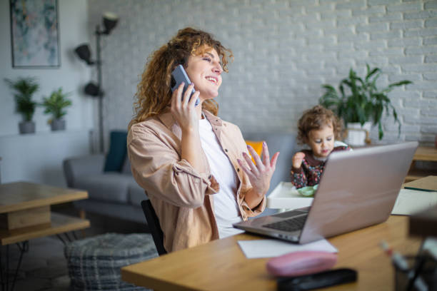 istock Young mother working from home while taking care of her baby 1972598706