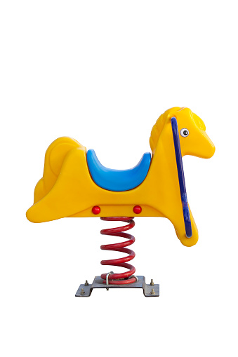 Yellow plastic spring rocking horse isolated on white background include clipping path.