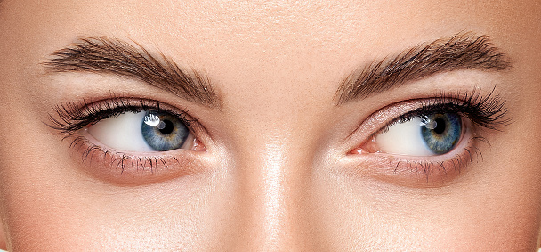 Close up studio shot of a beautiful woman with perfect skin