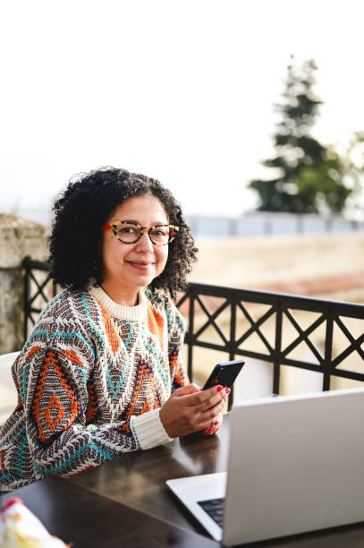 istock Multiracial freelancer working outdoors. 1972622970