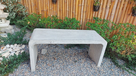 Black brown wooden table and bench in the garden