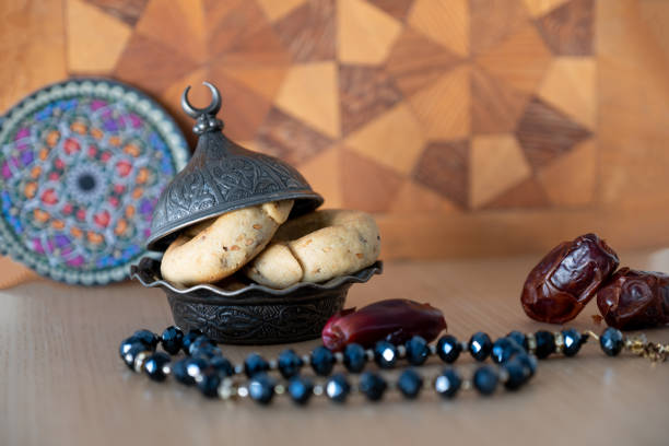 istock Arabic sweets with dates on arabesque background with arabian decorations 1972653086