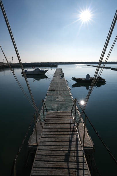 Almost deserted pier in winter at Humana (Riviera del Conero) touristic port