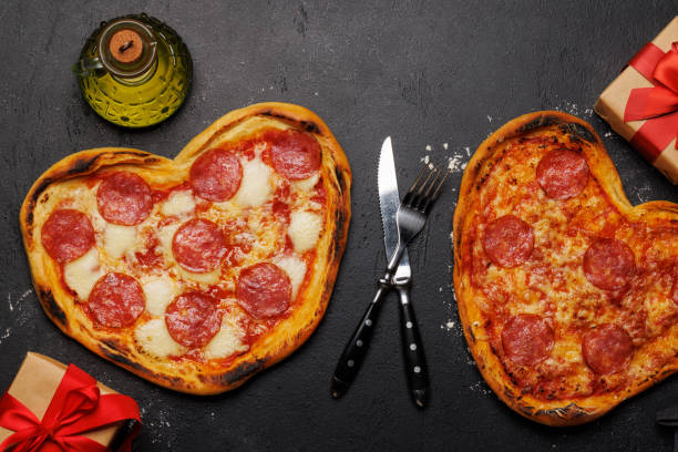 istock Heart-shaped pizzas: Delicious love-themed dish 1972690357