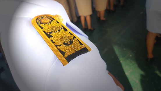 Shoulder board with Thai pattern, brass on black background, decoration for Thai government officials.