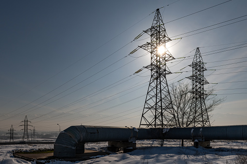 sunrise of prairie with power line in winter, alberta, canada.