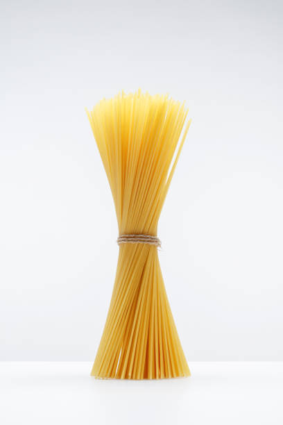 istock Bunch of spaghetti twisted together on a white background. 1972704436