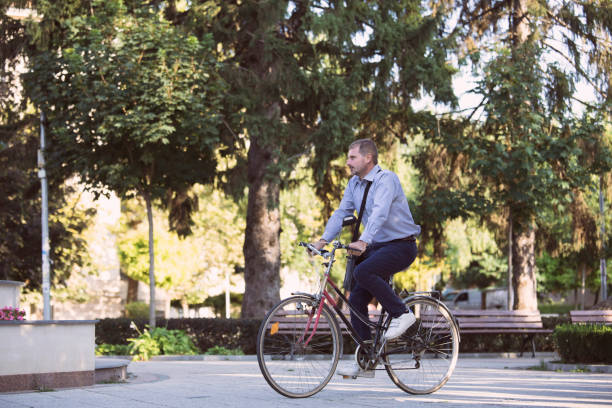 istock Businessman going to work by bike 1972705997
