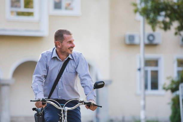 istock Businessman going to work by bike 1972707127
