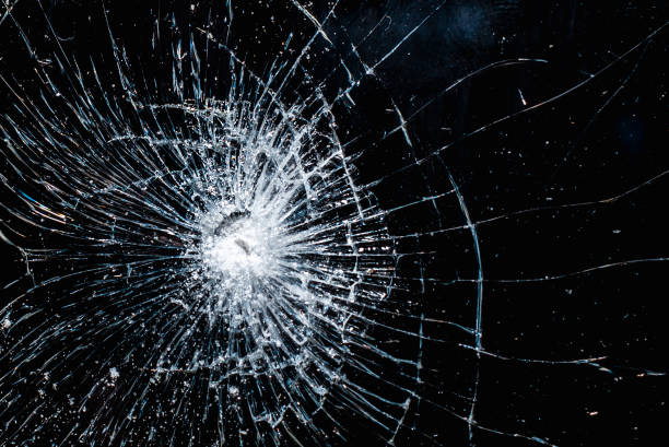 istock Broken glass texture on black background. Abstract of cracked screen smartphone from shock. 1972716216