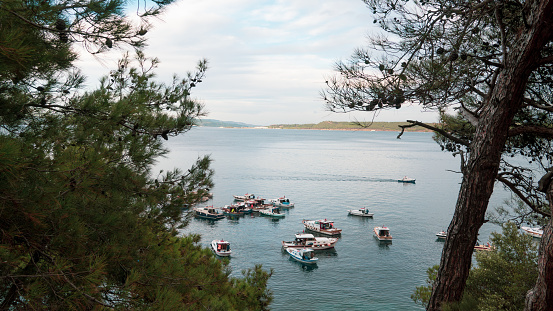 Canakkale, Turkey, Nov. 12, 2023 Small fishing boats anchored on the Kilitbahir coast. Kilitbahir is an old fishing town of Çanakkale.