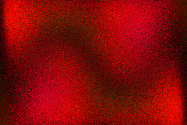 istock red color gradient dark grainy background, red gold yellow abstract on black, noise texture effect 1972747741