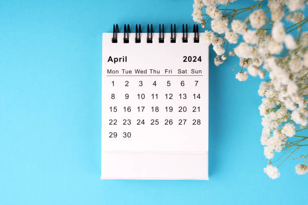 istock April 2024 calendar flat lay on blue background 1972757498