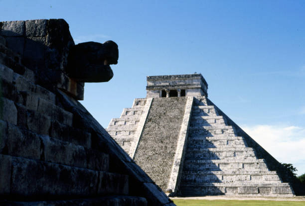 istock Chichen Itza. Mexico archaeological zone sculture if snake head 1972762896