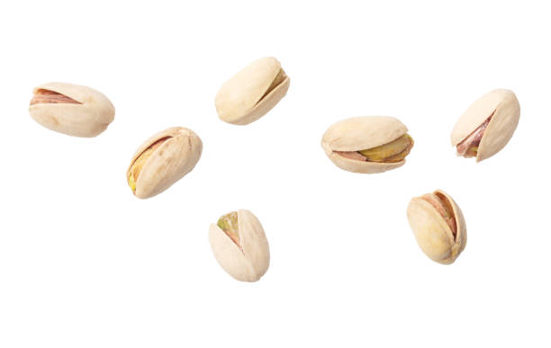istock Fresh pistachios isolated on white background. Macro 1972772307