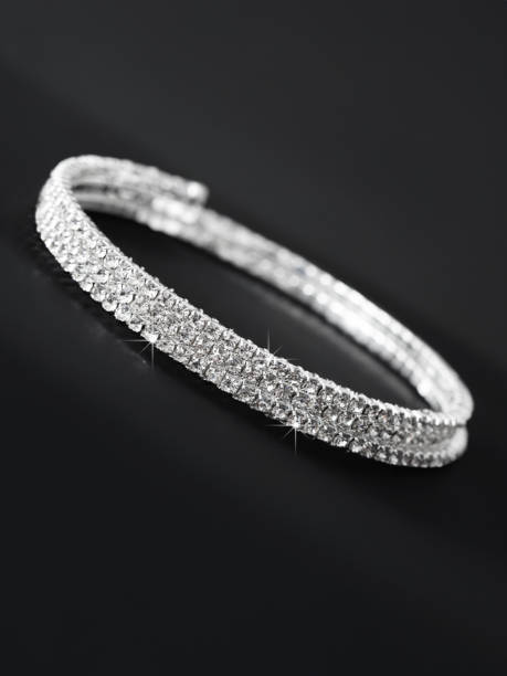 istock Silver bracelet isolated on black background 1972772824