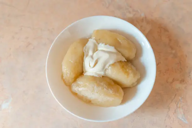 Photo of Traditional Lithuanian dish meal cuisine, stuffed meat potato dumpling,most popular Lithuanian national dish on a plate.