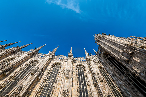 Low Angle View Of Majestic Duomo Windows And towers In Milan, Italy