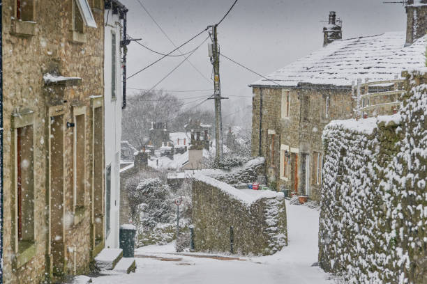 istock Winter street scene in Settle North Yorkshire with snow 1972787828