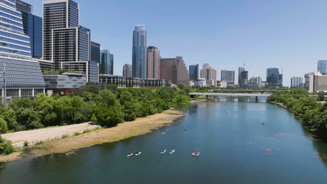 Aerial view circling kayaks on the Lady Bird Lake in sunny day in Austin, USA