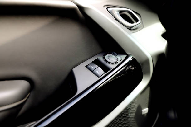 black interior of a modern car. Dashboard. Luxury leather steering wheel. Auto controls. Car doors inside. Car chairs and seats. Car sofa. Back and front row. Interior and door trim. High quality