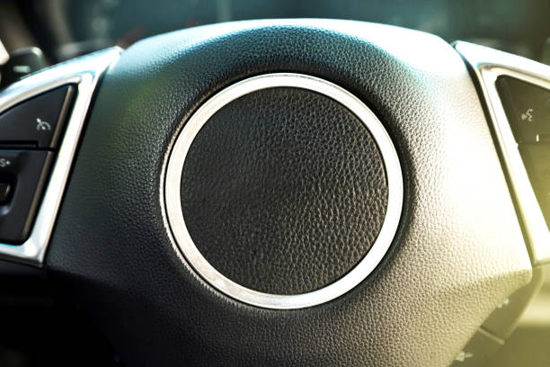 black interior of a modern car. Dashboard. Luxury leather steering wheel. Auto controls. Car doors inside. Car chairs and seats. Car sofa. Back and front row. Interior and door trim. High quality