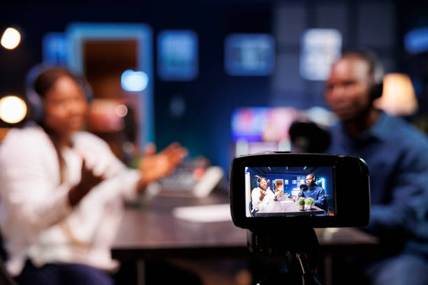 istock Device on a tripod filming a talk show 1972813325