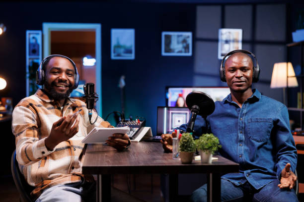 istock Black men hosting live talk show at home 1972818092