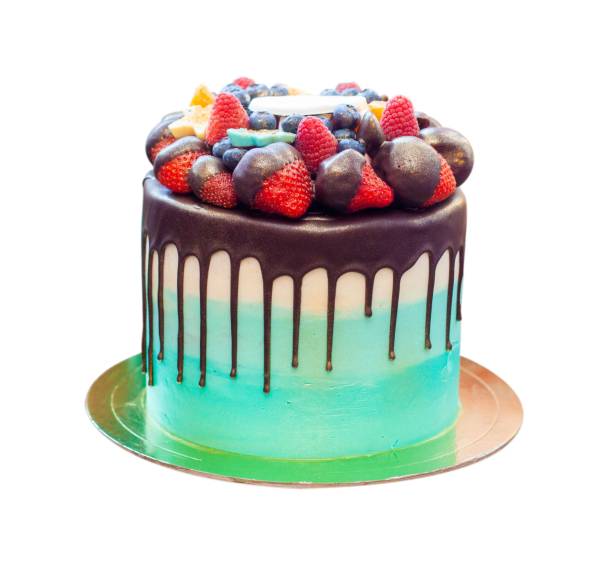 istock Green Birthday Drip Cake with chocolate ganache and fresh berries isolated on white background, close up, png with copy space aside 1972821449