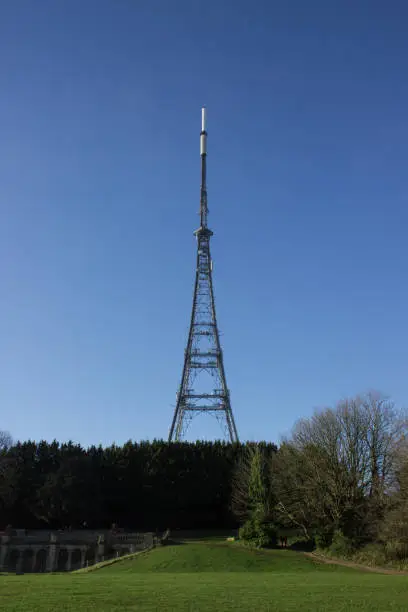 The Crystal Palace Transmitter tower viewed from Crystal Palace Park against a bright blue sky