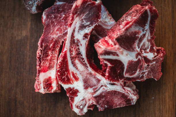 Sell beef spine on wooden board at market