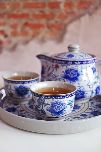English Vintage Porcelain Roses Tea Sets including teapot, tea cup, plate, spoon and tea filter.