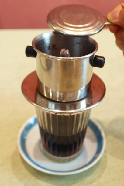 istock Closeup of People Brewing Vietnamese Drip Coffee 1972856509