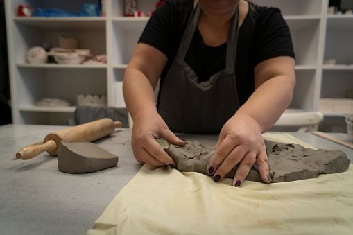 Ceramist artist female work in studio
