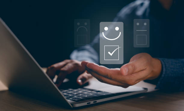 istock Customer service and Satisfaction concept, Businessman touching the virtual screen on the happy Smiley face icon to give satisfaction in service. rating very impressed. 1972880115
