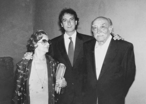 istock Young groom with his parents in 1968. 1972881216