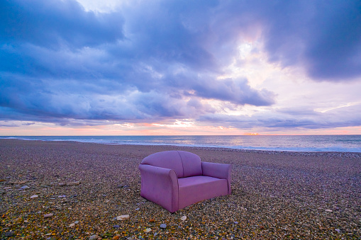 To sit on the throne chair on the beach and watch the waves