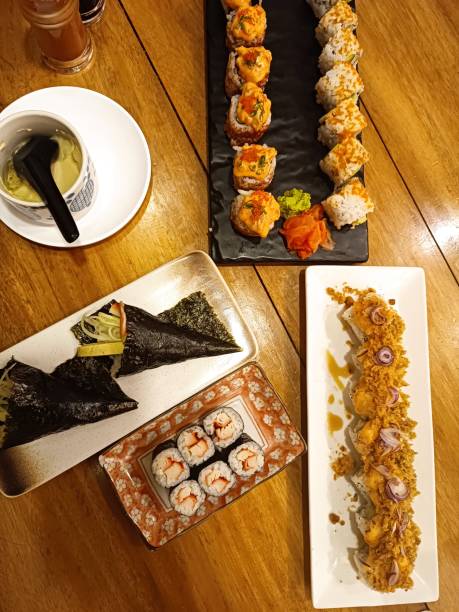 istock Variants Of Sushi Rolls on Wooden Table 1972934560