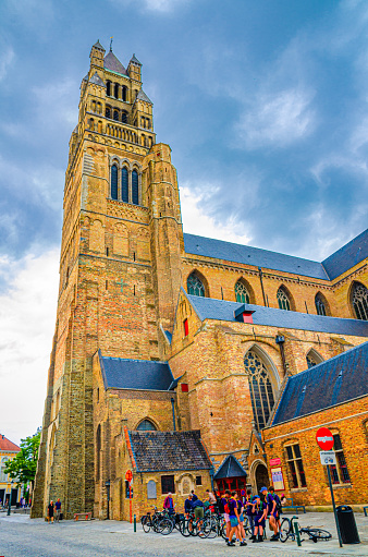 Bruges, Belgium, July 4, 2023: St. Salvator's Cathedral of the Saviour and St. Donat Roman Catholic church Romanesque architecture style tower in Brugge city historical centre, West Flanders province