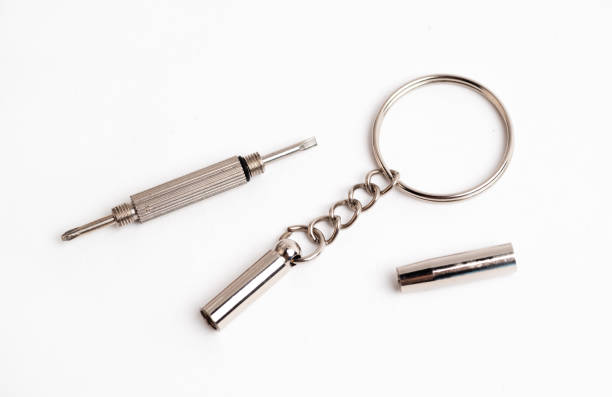 istock Two screwdrivers on a key ring for glasses, watches and a phone. Keyring tool Double-sided screwdriver 1972947956