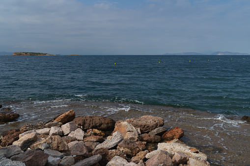 Rocky shore of the Myrto Sea on a summer day. High quality photo