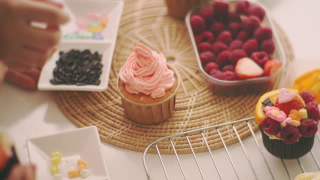 Decorate cupcakes with fruit