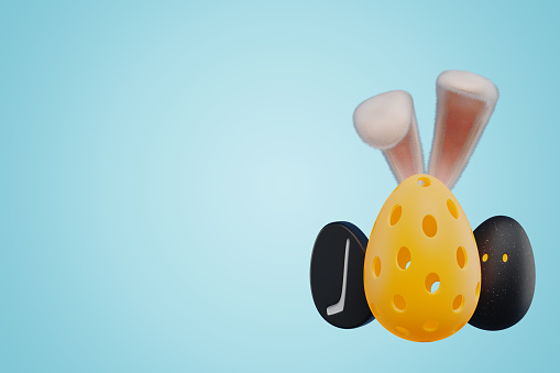 Sports balls for pickleball hockey squash in the shape of an egg with Easter bunny ears. 3d rendering