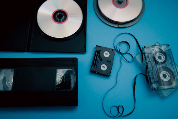 istock The evolution of media. Old fashioned media storage audio, video cassette tapes evolution cd, dv, dvd. 1972990584