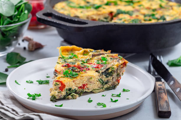 istock Piece of brunch egg frittata with vegetables on plate, horizontal 1972994842