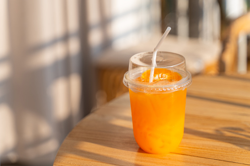 fresh orange juice in plastic glass,orange juice