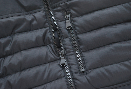 Closeup of zipper on a mass produced quilted winter coat.