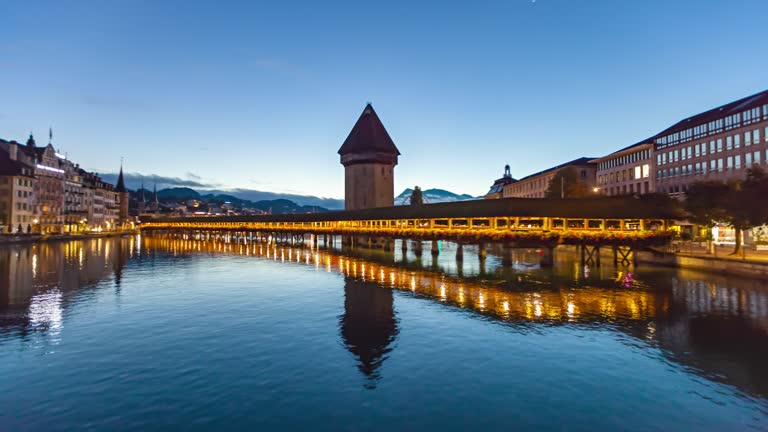Night to day hyper lapse panorama Lucerne old town and Chapel bridge (Kapellbrucke), Switzerland.