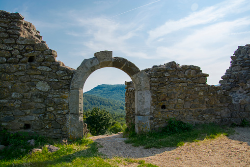 Gate of the ruined Castle of Dregely on the top of the mountain