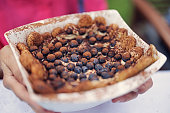 Closeup of tiramisu cake at an outdoors celebration meal